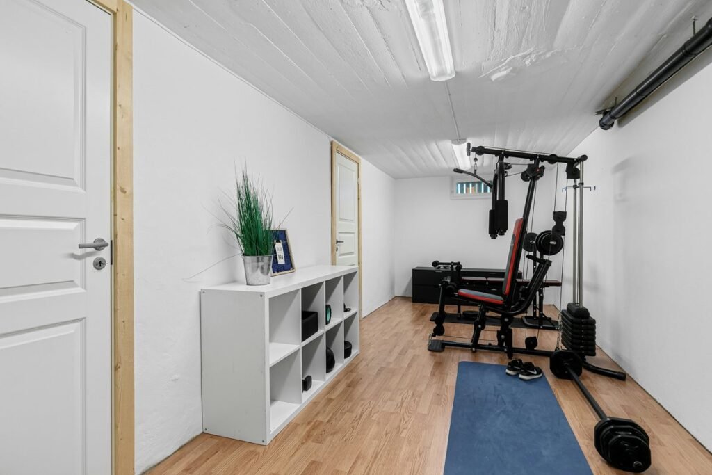Bright spare room with a home gym corner